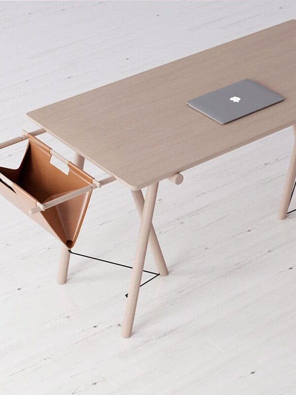Minimalist wooden desk with laptop and hanging storage